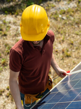 technician adjusting solar panels 2021 09 24 03 45 06 utc e1697738494906